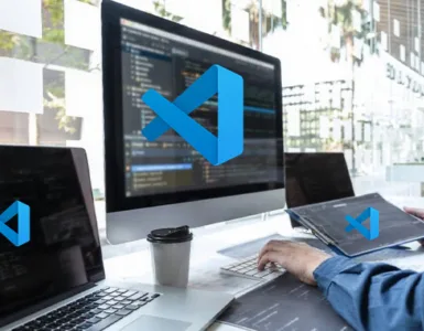 Image, photo d'un bureau de développeur avec le logo VS Code ou Visual Studio Code.